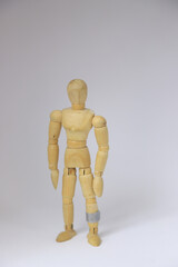 wooden mannequin isolated on white background