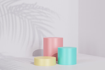 Colorful podiums or pedestals for products or advertising on beige pastel background with tropical leaf shadow, minimal 3d render