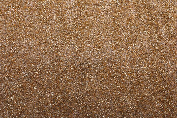 Shiny light brown glitter as background, closeup