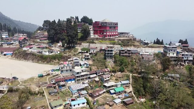 KOLKATA, INDIA - May 02, 2021: Aerial view of city of Neora Valley with Rishop and Lava in the background. Hill station with buildings in the steep valley.