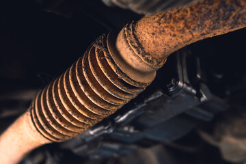 old exhaust pipe, flexible corrugation requires replacement, repair and maintenance. Car service,...