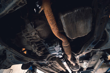 old exhaust pipe, flexible corrugation requires replacement, repair and maintenance. Car service,...
