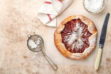 Homemade rhubarb galette made with star pattern on old concrete table background. Process of baking. Open pie. Christmas and New Years baked goods. Top view of homemade pie crust on the table.