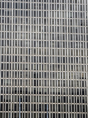 Fototapeta premium Abstract facade of modern building with only windows