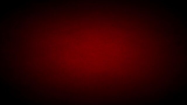 Moody red and black grunge texture background, with a dark flickering vignette 