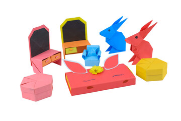 Watch made with some small craft paper and placed on a white background