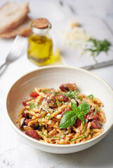 Fusilli Pugliesi with salsiccia, eggplant, cherry tomatoes and olives