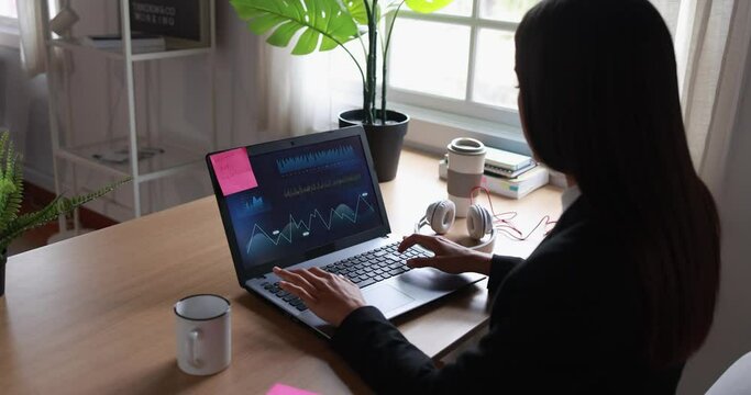 Young woman working inside office doing trading research - Business concept