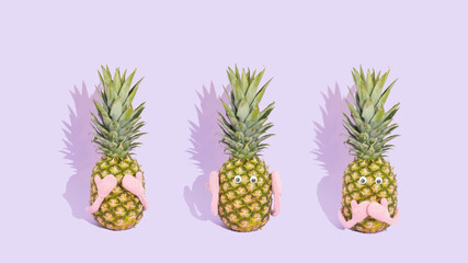 Three fresh pineapples like three wise monkeys. Concept of see no evil, hear no evil and speak no...