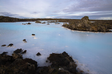Views of moss covered lava fields and milky blue waters near the Blue Lagoon, Iceland