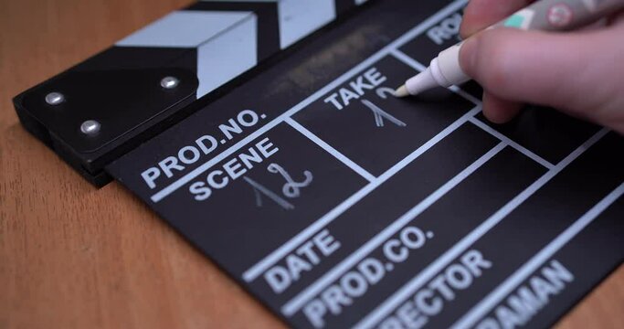 Clapperboard on set. Movie production. Cinema stage. Clapper write number of scene on the board. Holywood concept