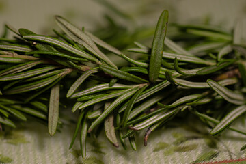 Rosemary leaves on a cutting board