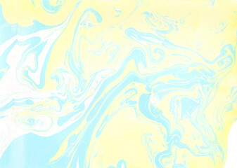青と黄色の水彩絵具で描いたマーブリング模様