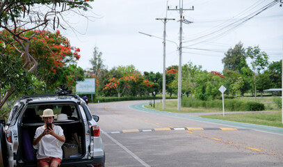 Asian woman driving on a summer vacation