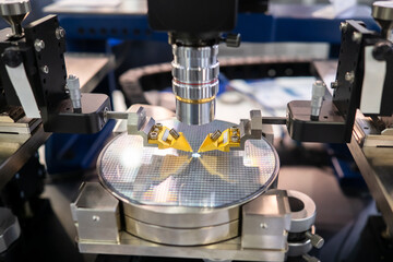 Manufacture of chips on a printed circuit board under a microscope. Process of creating a transistor microchip. Equipment for testing and production chips. Microchip automated production.