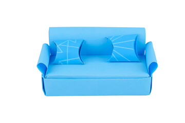 Big sofa made with small craft paper and nicely placed on a paper background