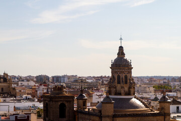 Fototapeta na wymiar Torre e Iglesia de la Anunciacion en la ciudad de Sevilla o Seville, comunidad autonoma de Andalucia o Andalusia, pais de España o Spain
