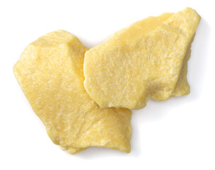 raw cocoa butter isolated on white background, top view