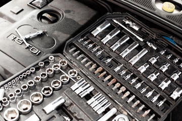 set of tools and car engine