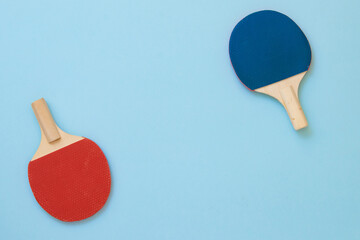 Wooden red and blue ping pong paddles