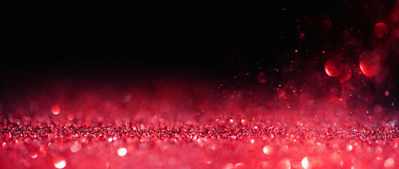 Abstract blur red glitter on black background. Card for Valentine's day, christmas and wedding...