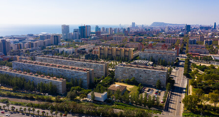 Fototapeta premium Aerial view of new residential complex of Diagonal Mar i el Front Maritim del Poblenou on sunny fall day, Barcelona, Spain
