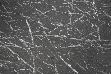 Black plastic broken paper texture. Plastic background.