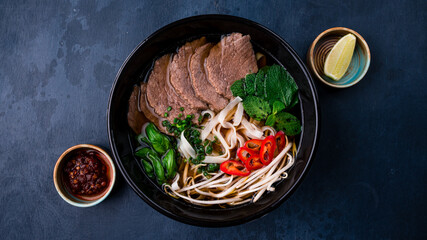 Pho bo, Vietnamese food, rice noodle soup with sliced beef - obrazy, fototapety, plakaty