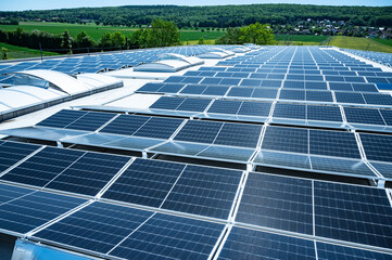 Large solar plant on an industrial hall generates renewable energy
