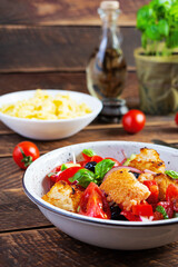 Traditional italian salad Tuscan Panzanella with tomato, bread and pickled olives