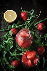 Healthy detox drink with strawberries and arugula. Summer tonic cocktail.