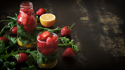 Healthy detox drink with strawberries and arugula. Summer tonic cocktail.