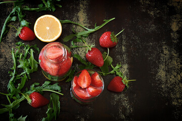 Healthy detox drink with strawberries and arugula. Summer tonic cocktail.