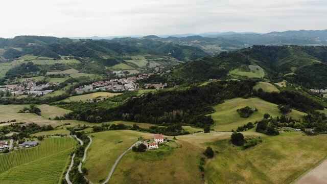 Summer aerial view of the Tuscan landscape (Italy) and typical rustic villa.