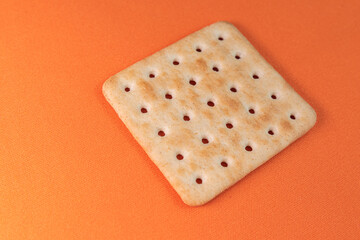 Salt crackers on the orange background