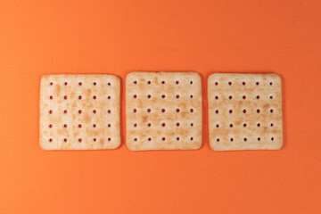 Salt crackers on the orange background