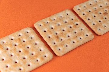 Salt crackers on the orange background