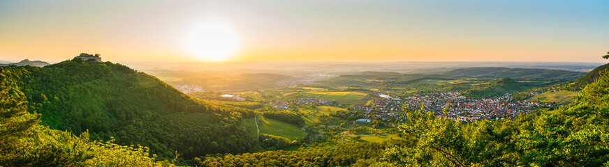 Germany, XXL Panorama of castle ruins hohenneuffen on top of a forested mountain with wide view...