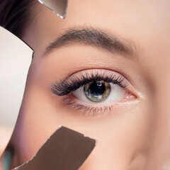 Macro photo of creative trendy eyelash extension, eye skin care. Concept of dry eyes, micro cracked...