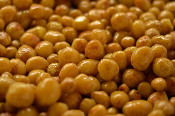 Blurred image of baked young potatoes. Vegetarian food.