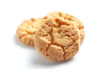 Close-up of delicious freshly baked simple cookies or biscuits. Isolated over studio white background