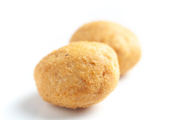 Close-up of freshly baked spicy Dry kachori or crunchy balls filled with spicy dry chutney traditionally authentic Rajisthani and Gujrati. Isolated over studio white background