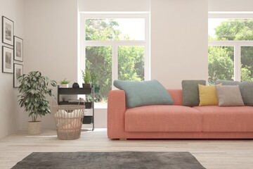 White living room with sofa and summer landscape in window. Scandinavian interior design. 3D illustration