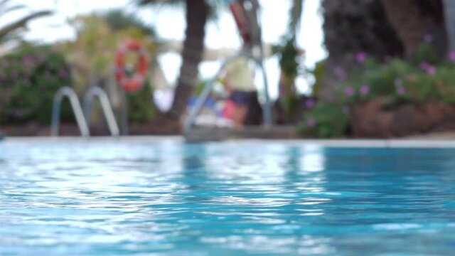 Water in the swimming pool in tropical resort in slow motion 120fps