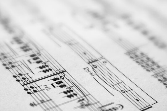 Close up of musical notes. Blurred and sharp areas. Dreamy effect. Black and white.