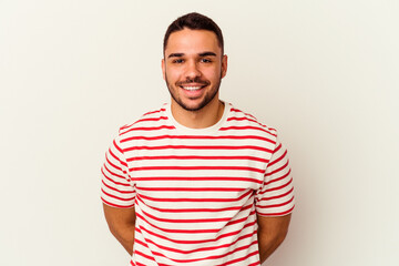 Obraz premium Young caucasian man isolated on white background happy, smiling and cheerful.
