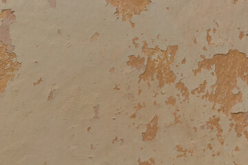 Orange texture of old plaster. Сracked wall texture plaster yellow shades background. 
