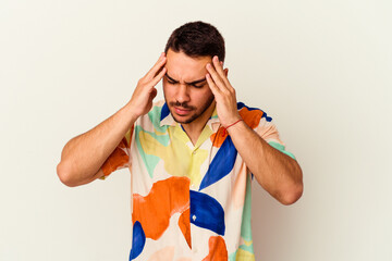 Young caucasian man isolated on white background touching temples and having headache.