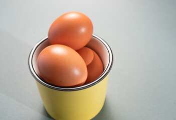 Fresh Chicken brown eggs on table