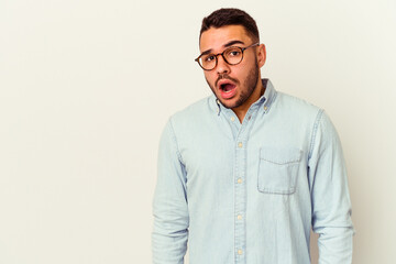 Fototapeta premium Young caucasian man isolated on white background being shocked because of something she has seen.